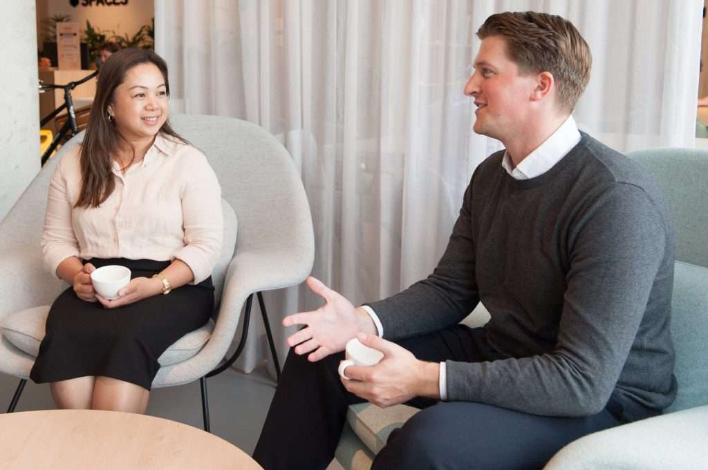 Candidate and Manager having an interview at a table